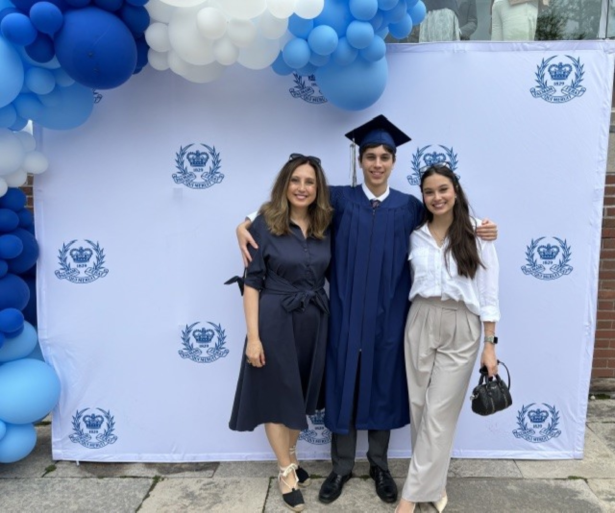 Filiz Altinoglu with her son and daughter at Upper Canada College graduation ceremony — the moment that confirmed everything she believes about the right school.