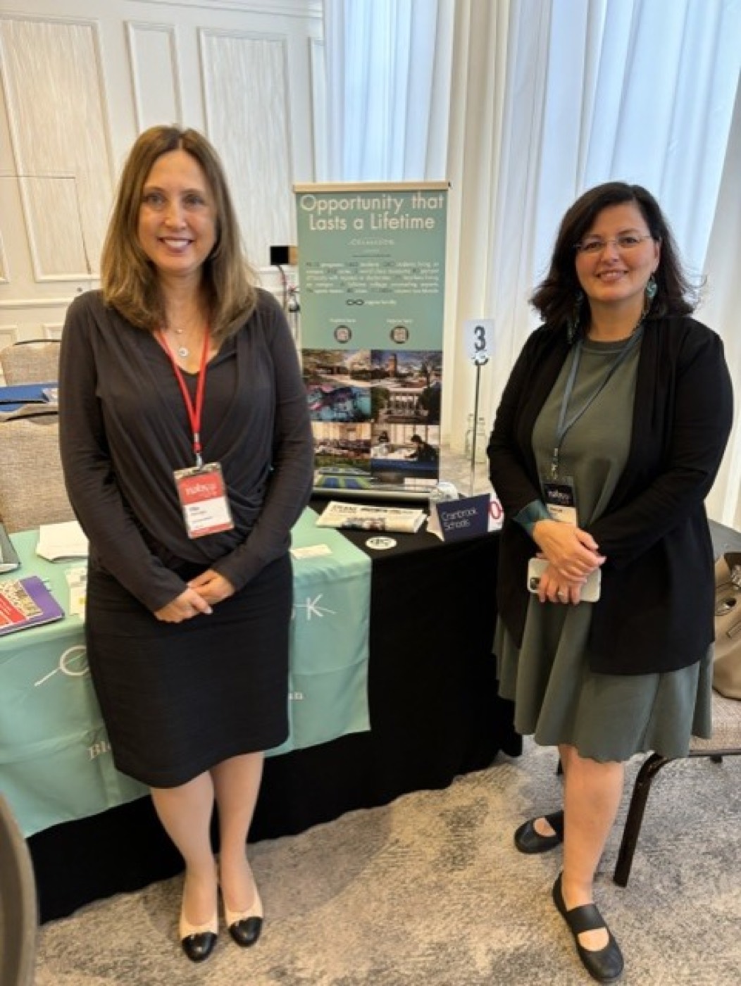 Filiz Altinoglu with a colleague at an independent schools conference booth